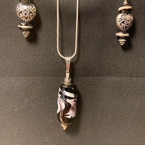 Uniquely designed and hand crafted lamp work bead pendant with matching earrings